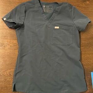 Figs scrubs in XXS top and XS jogger bottom. Stormy blue.